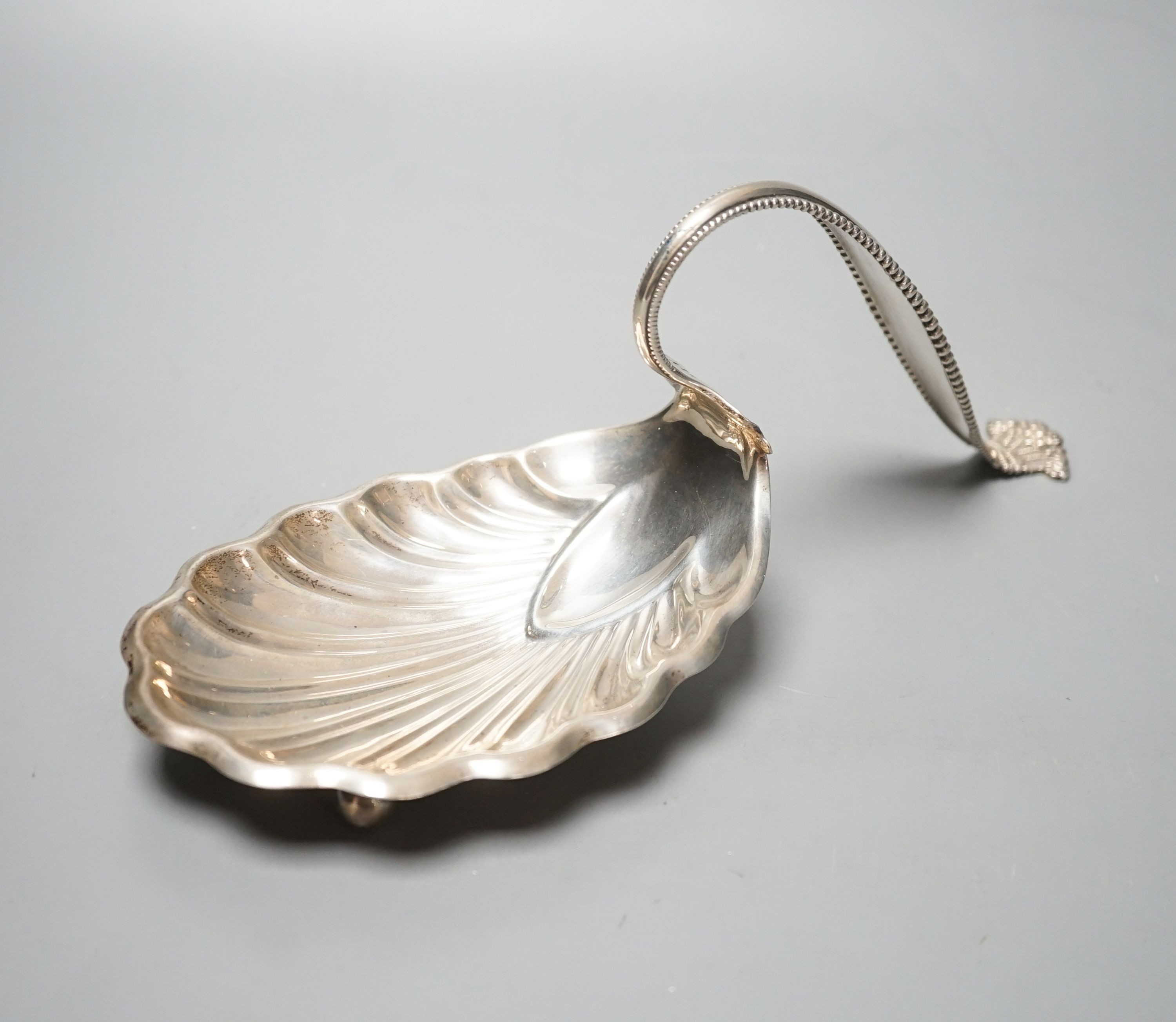 A sterling spoon shaped shell dish, by George W Schleiber & Co, 26.5cm, 6oz.